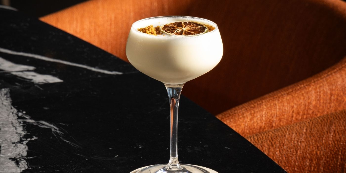 Cocktail with dried citrus garnish promoting Daily Happy Hour at Aviator Bar in Mawson Lakes, Adelaide