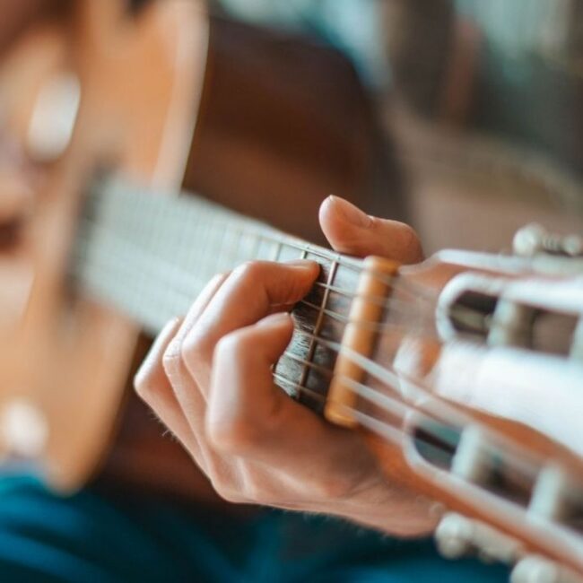 Acoustic guitar performance promoting live music at Ember & Vine in Mawson Lakes, Adelaide