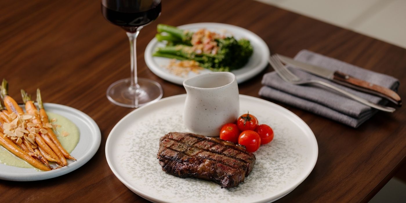 Grilled steak with red wine and vegetable sides for Steak & Shiraz Thursday at Ember & Vine in Mawson Lakes, Adelaide